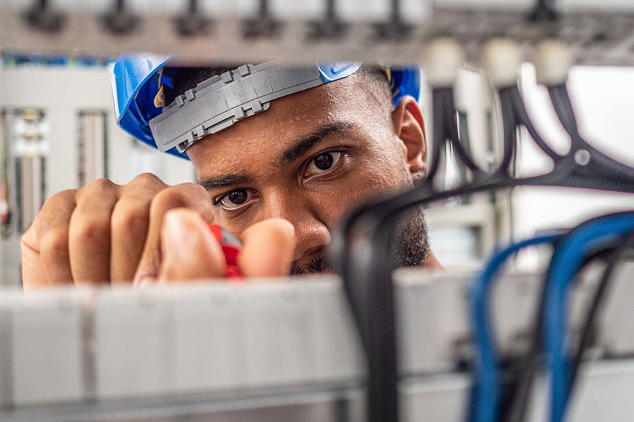 Superior Skilled Trades Low Voltage Technician performing work in a datacenter